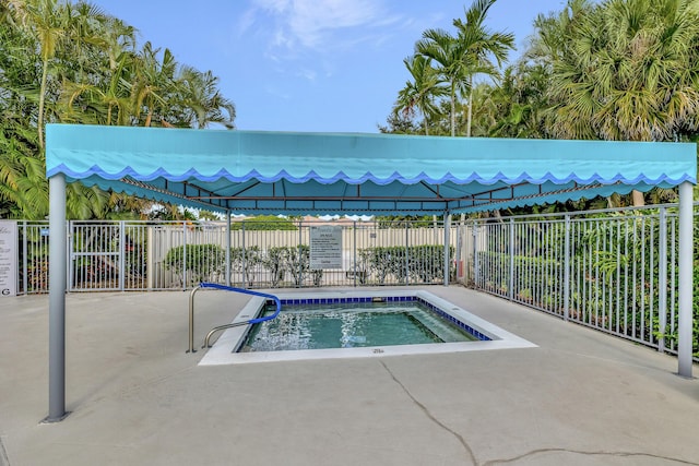 view of swimming pool featuring fence