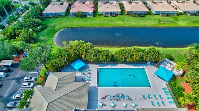 drone / aerial view with a residential view and a water view