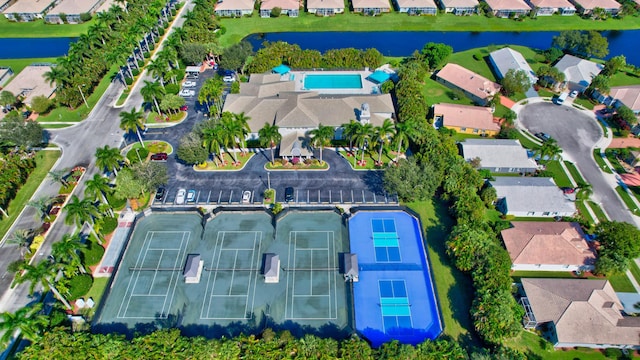drone / aerial view with a residential view and a water view