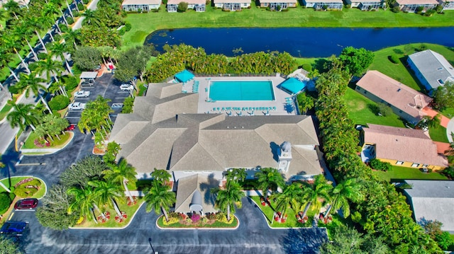 drone / aerial view featuring a water view and a residential view