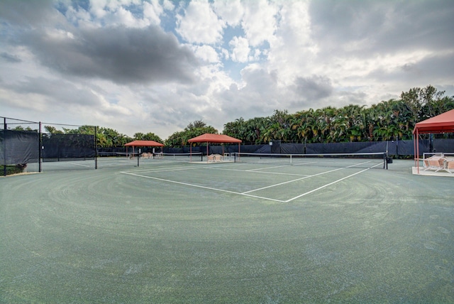 view of sport court featuring fence