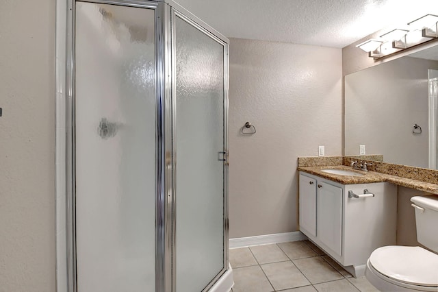 full bathroom with toilet, a stall shower, vanity, a textured ceiling, and tile patterned floors