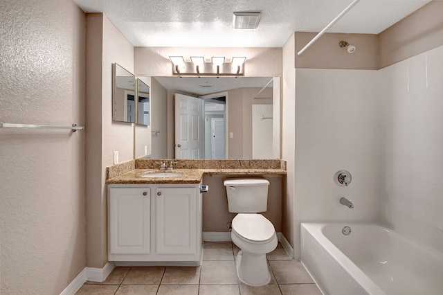 bathroom with a textured ceiling, tile patterned flooring, toilet, visible vents, and washtub / shower combination