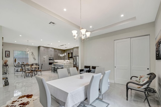 dining space featuring a chandelier