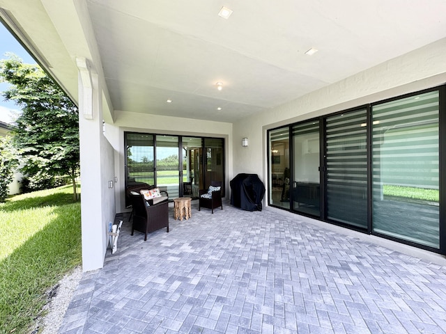 view of patio featuring a grill