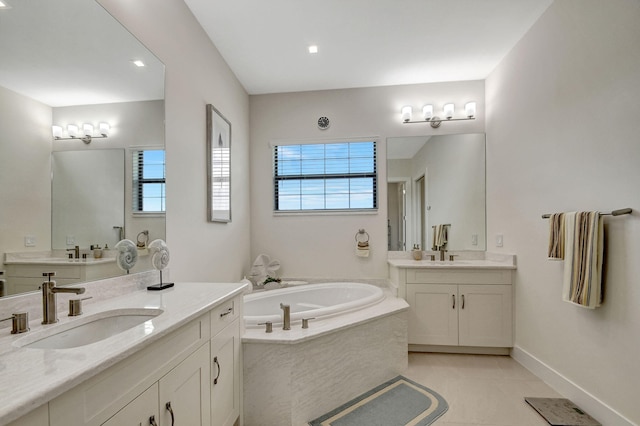 bathroom featuring vanity, tile patterned flooring, and a washtub