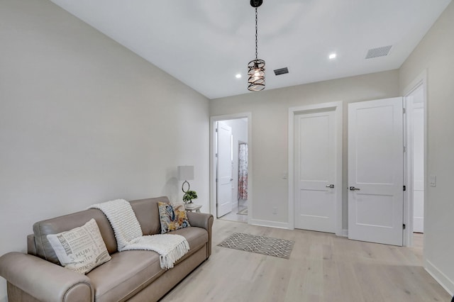 living room with light hardwood / wood-style floors