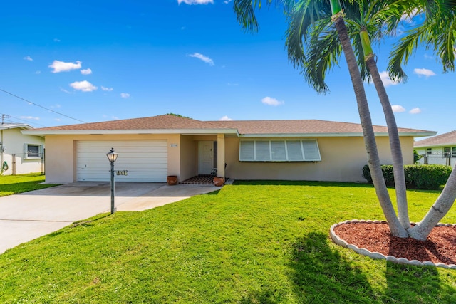 single story home featuring a garage and a front lawn