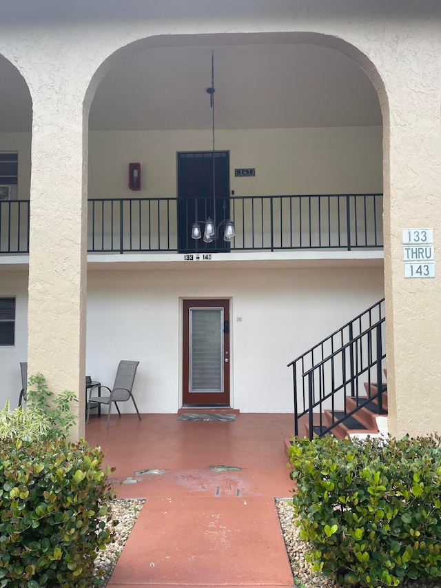 doorway to property featuring a balcony