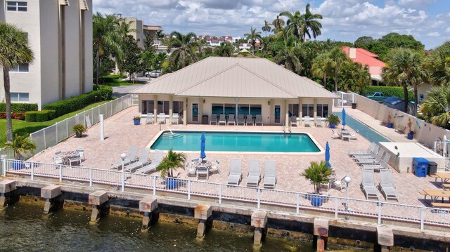 birds eye view of property with a water view