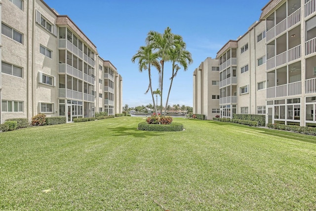 view of home's community featuring a lawn