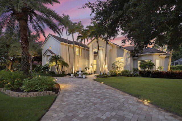 view of front of property with a lawn