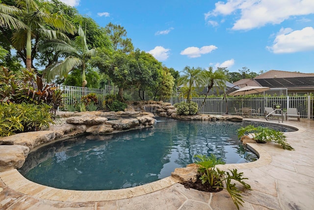 view of swimming pool with a patio