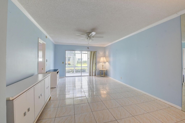 spare room featuring crown molding, ceiling fan, a textured ceiling, and light tile patterned floors