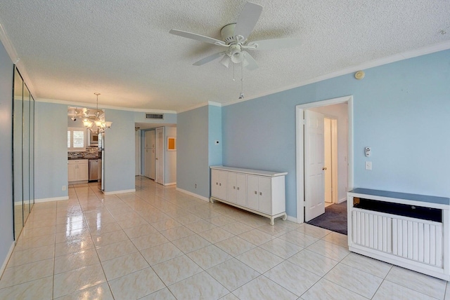 unfurnished room with crown molding, ceiling fan with notable chandelier, a textured ceiling, and light tile patterned floors