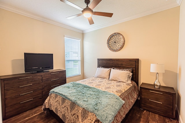 bedroom with ceiling fan, dark hardwood / wood-style floors, a textured ceiling, and ornamental molding