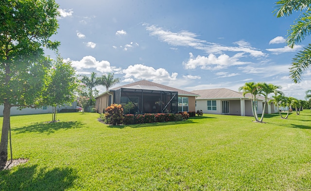 view of yard with a lanai