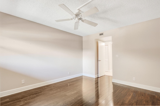 empty room featuring ceiling fan, a textured ceiling, and hardwood / wood-style flooring