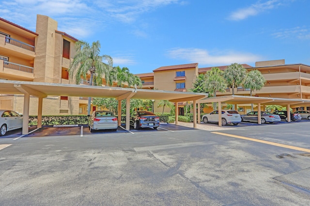 view of parking / parking lot with a carport