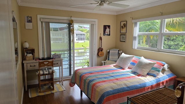 bedroom with ceiling fan, ornamental molding, and hardwood / wood-style floors