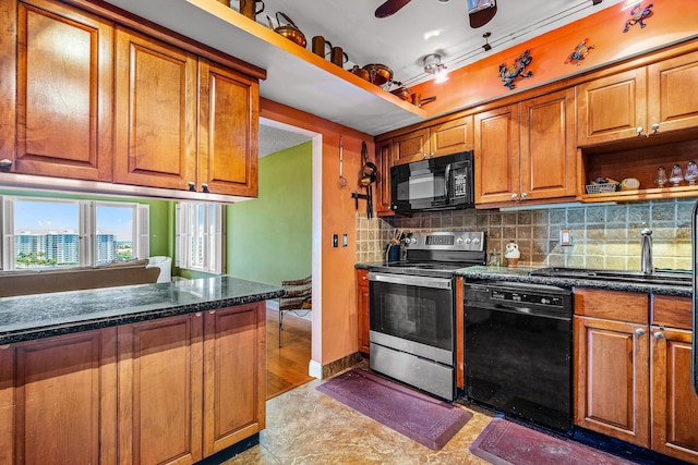 kitchen with black appliances, sink, ceiling fan, light tile patterned floors, and tasteful backsplash