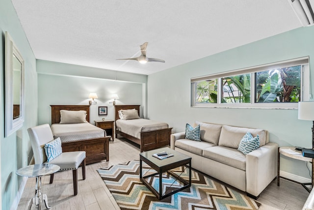 bedroom with hardwood / wood-style flooring and ceiling fan