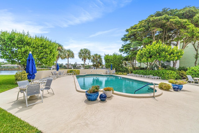 view of swimming pool featuring a patio area