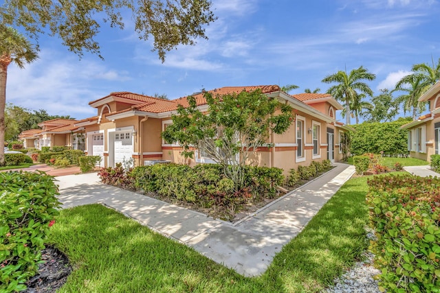 mediterranean / spanish-style house featuring a garage