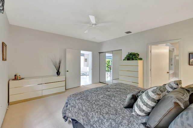 carpeted bedroom with ceiling fan, connected bathroom, and a closet