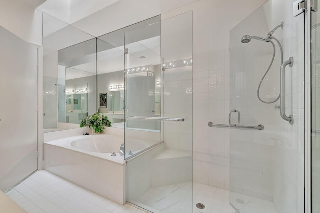 bathroom featuring shower with separate bathtub