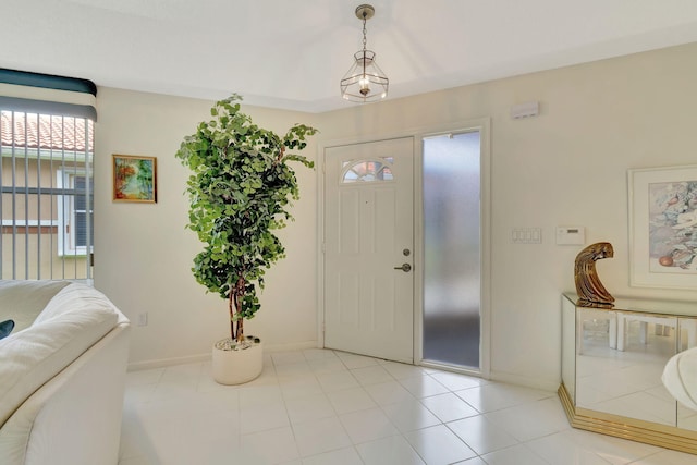 foyer featuring light tile patterned floors