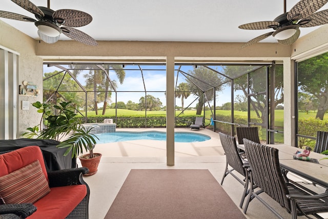 view of pool with ceiling fan, a lanai, and a patio