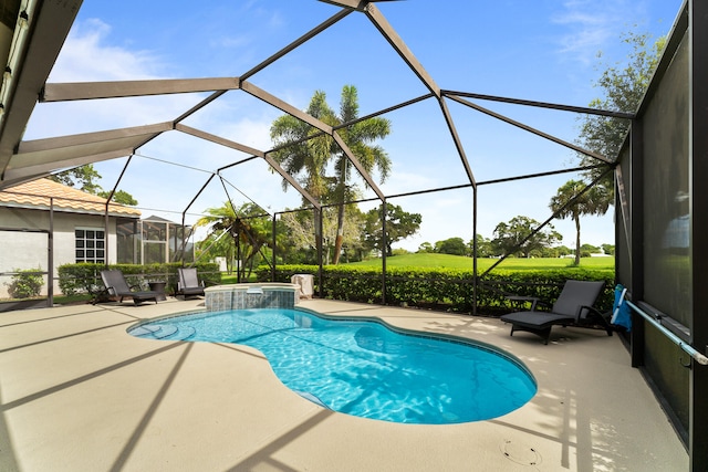 view of swimming pool with glass enclosure and a patio area