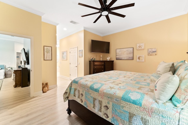 bedroom with ceiling fan, light hardwood / wood-style floors, and crown molding