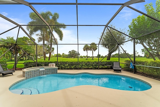 view of swimming pool featuring glass enclosure, a pool with connected hot tub, and a patio