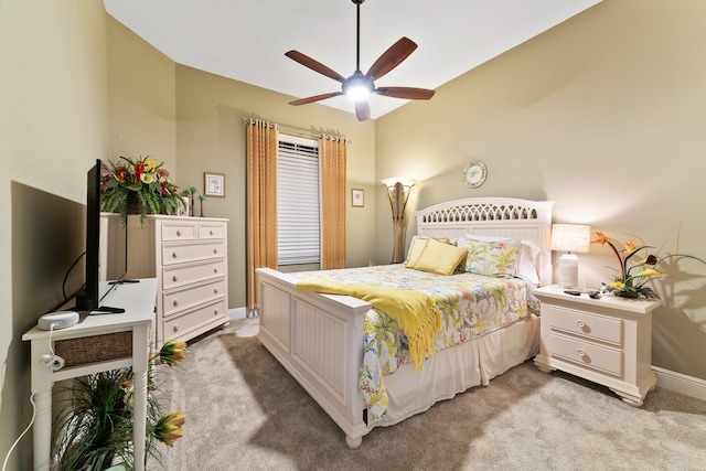 bedroom with ceiling fan and light carpet