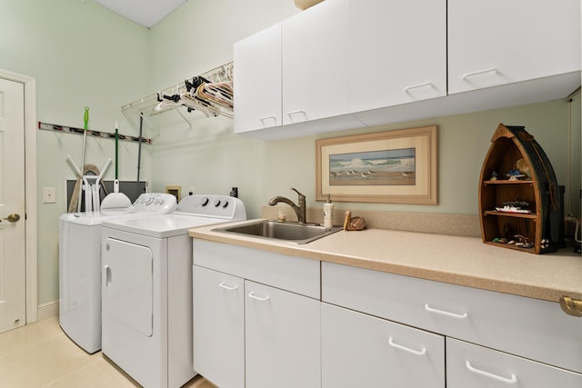 laundry area featuring cabinets, light tile patterned floors, independent washer and dryer, and sink