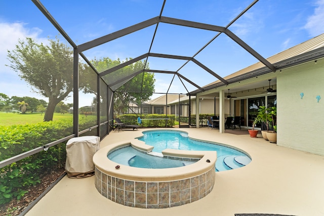 view of swimming pool featuring a lanai, ceiling fan, and a patio