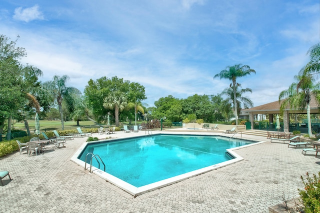 view of swimming pool featuring a patio area