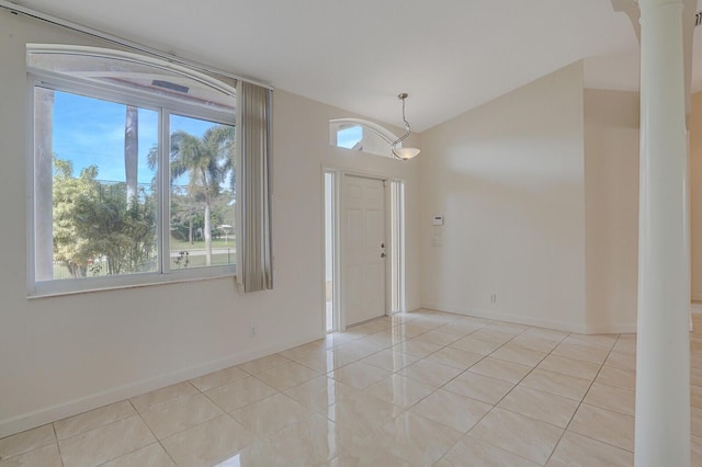 tiled foyer with lofted ceiling