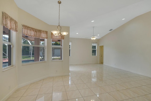 spare room featuring ceiling fan, lofted ceiling, and light tile patterned floors