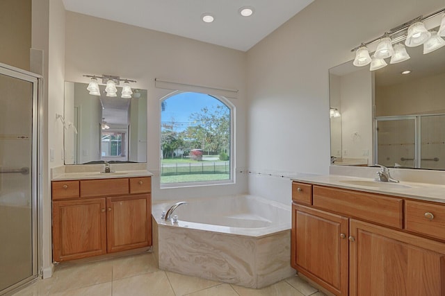 bathroom featuring tile patterned floors, independent shower and bath, and vanity