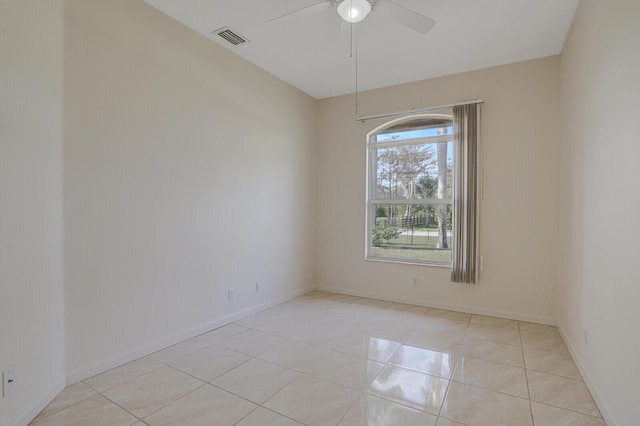 unfurnished room with light tile patterned floors and ceiling fan