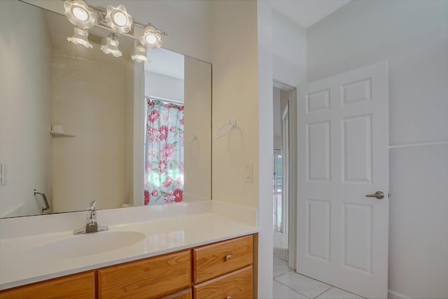 bathroom with tile patterned floors and vanity