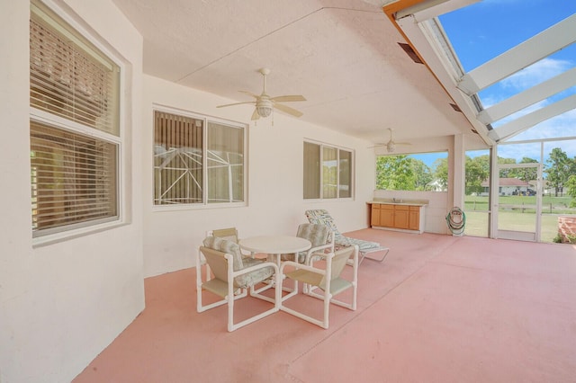 view of patio featuring ceiling fan