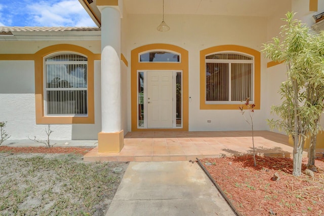 doorway to property featuring a patio area