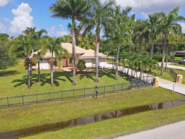 view of front facade with a garage and a front yard