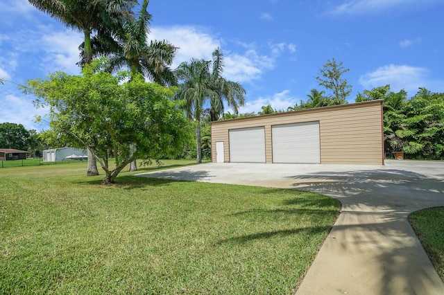 garage with a yard