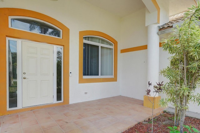 entrance to property with a patio area