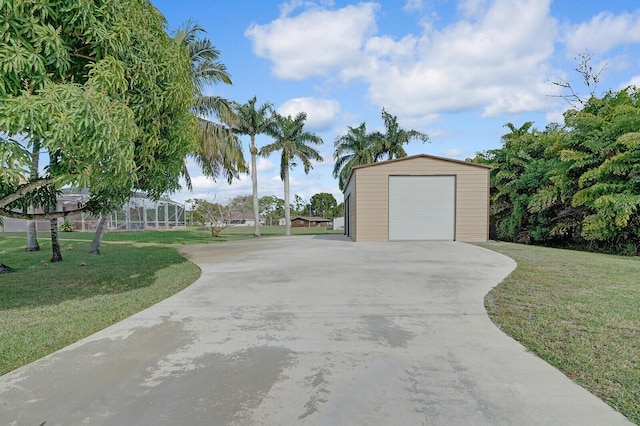 garage featuring a lawn